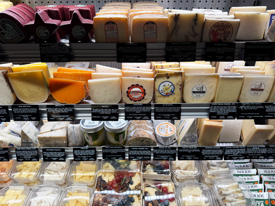 Assortment of specialty cheeses and prepared cheese selections at Erewhon.