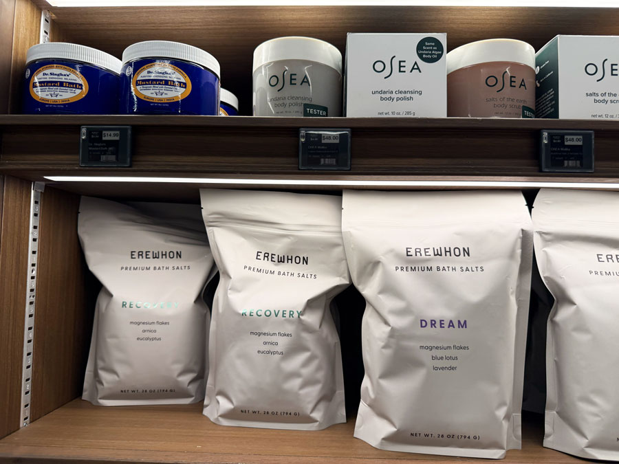 Erewhon Premium Bath Salts alongside OSEA body scrubs and polishes.