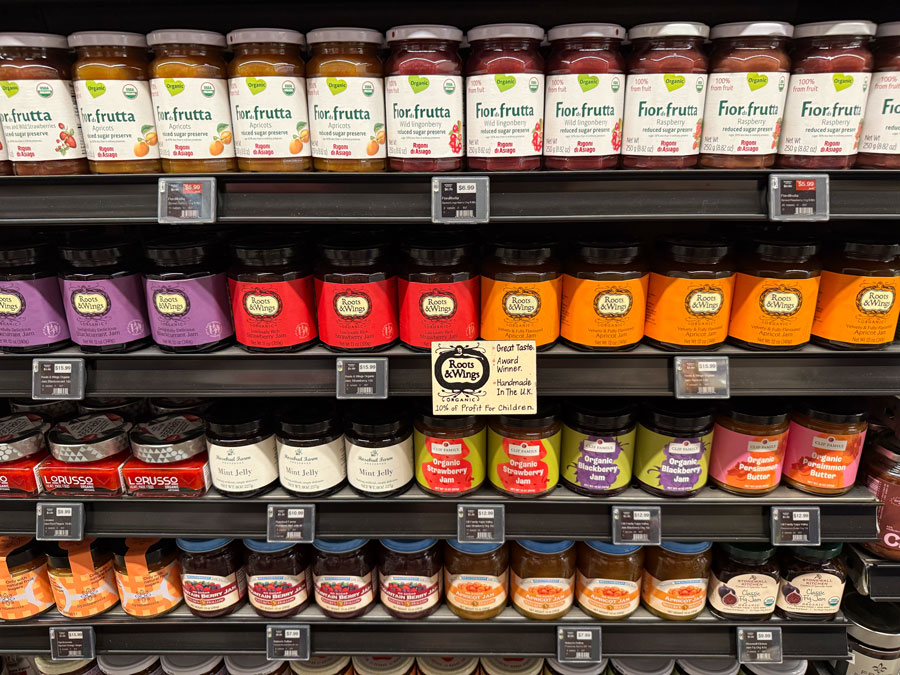 Organic fruit jams and preserves in raspberry, apricot, and other flavors.